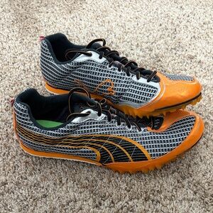 Puma Complete Black and Orange TFX lo spikes women’s 8.5